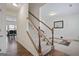 Bright hallway featuring a staircase, hardwood floors, and neutral walls at 1560 Avalon Creek Rd, Sugar Hill, GA 30518