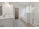 Stylish bathroom with double sinks, soaking tub, glass shower, and contemporary fixtures at 4003 Garden Ln, College Park, GA 30337