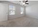 Bright bedroom with two windows and a ceiling fan at 4003 Garden Ln, College Park, GA 30337