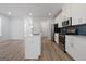 Beautiful kitchen features a spacious island, stainless steel appliances, and seamless flow into the living area at 4003 Garden Ln, College Park, GA 30337