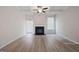 Bright living room area with modern fireplace, ceiling fan, and an open layout concept at 4003 Garden Ln, College Park, GA 30337
