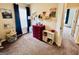 A room, decorated with a mountain scene and other artwork and toys at 1741 Portwest Way, Hampton, GA 30228