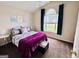 Cozy bedroom with vaulted ceiling, large window, and neutral carpet at 1741 Portwest Way, Hampton, GA 30228