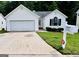 Charming one-story home with a well-maintained front yard and an attached garage at 1741 Portwest Way, Hampton, GA 30228