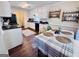 Eat-in kitchen area with natural light, wooden chairs, and white cabinets at 1741 Portwest Way, Hampton, GA 30228