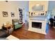 Cozy living room featuring a fireplace, bookshelf, and comfortable seating at 1741 Portwest Way, Hampton, GA 30228