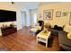 Spacious living room with hardwood floors, ample seating, and a welcoming atmosphere at 1741 Portwest Way, Hampton, GA 30228