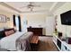Comfortable main bedroom featuring soft, neutral tones and a view of the backyard at 1741 Portwest Way, Hampton, GA 30228