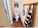 A half bathroom is decorated with mountains and colorful decorations at 1741 Portwest Way, Hampton, GA 30228