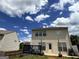 The exterior of the home showcasing a deck and a fenced backyard at 1369 Star Water Dr, Lawrenceville, GA 30045