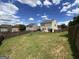 The home features a spacious backyard, enclosed by a wooden fence for added privacy at 1369 Star Water Dr, Lawrenceville, GA 30045