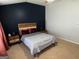 Cozy bedroom decorated with a wooden headboard and two nightstands at 1369 Star Water Dr, Lawrenceville, GA 30045