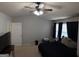 Spacious bedroom with a ceiling fan and neutral-toned walls and carpets at 1369 Star Water Dr, Lawrenceville, GA 30045