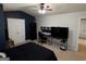 Well-lit bedroom featuring a gaming setup and an open layout at 1369 Star Water Dr, Lawrenceville, GA 30045