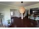 Bright foyer with hardwood floors, stylish pendant lighting, leading to living spaces and a view of the staircase at 1369 Star Water Dr, Lawrenceville, GA 30045