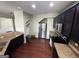 Bright kitchen with stainless steel appliances, granite countertops, dark cabinets, and a hardwood floor at 1369 Star Water Dr, Lawrenceville, GA 30045
