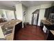 Modern kitchen featuring stainless steel appliances, granite countertops, dark cabinets, and hardwood flooring at 1369 Star Water Dr, Lawrenceville, GA 30045