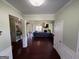 Inviting living room with hardwood floors, decorative columns and archways, modern lighting, and a comfortable seating area at 1369 Star Water Dr, Lawrenceville, GA 30045