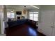 Cozy living room with hardwood floors, a fireplace, and large windows providing plenty of natural light at 1369 Star Water Dr, Lawrenceville, GA 30045