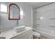 Modern bathroom featuring vanity, lighting, tile, and shower with tub combination at 50 Caroline Ave, Stockbridge, GA 30281