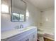 Clean bathroom featuring a sink vanity, modern lighting, and a combined tub and shower at 50 Caroline Ave, Stockbridge, GA 30281