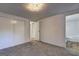 Carpeted bedroom offering a closet and access to an en-suite bathroom at 50 Caroline Ave, Stockbridge, GA 30281