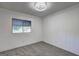Comfortable carpeted bedroom filled with plenty of natural light from the window at 50 Caroline Ave, Stockbridge, GA 30281