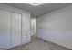 Bedroom featuring soft carpeting, closet, and access to the hallway at 50 Caroline Ave, Stockbridge, GA 30281