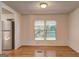 Bright dining area with hardwood floors and natural light streaming through the window at 50 Caroline Ave, Stockbridge, GA 30281