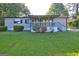 Charming home with a cozy front porch and well-maintained lawn at 50 Caroline Ave, Stockbridge, GA 30281