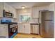 Updated kitchen equipped with stainless steel appliances and white subway tile at 50 Caroline Ave, Stockbridge, GA 30281