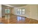 Inviting living room showcasing beautiful hardwood floors and large windows at 50 Caroline Ave, Stockbridge, GA 30281