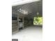 Barn interior features a white ceiling with wooden horse stalls and secure metal gates at 155 Green Meadow Ln, Fayetteville, GA 30215