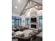 Inviting living room with stone fireplace, cathedral ceilings, and ample seating at 155 Green Meadow Ln, Fayetteville, GA 30215