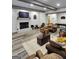Spacious living room with brick fireplace, beamed ceiling, and comfortable seating around wood coffee tables at 155 Green Meadow Ln, Fayetteville, GA 30215