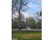 Pastoral setting with mature trees, fenced pasture, and horses grazing at 155 Green Meadow Ln, Fayetteville, GA 30215