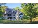 Beautiful rear exterior featuring a pool, patio and lush green lawn with a fence at 155 Green Meadow Ln, Fayetteville, GA 30215