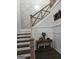 Beautiful staircase with custom wood railing, wainscoting, and modern design at 155 Green Meadow Ln, Fayetteville, GA 30215