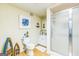 Beach themed bathroom with a walk-in shower and wood laminate floors at 3006 Gold Creek Dr, Villa Rica, GA 30180