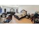 Bedroom with a wooden frame bed, an area for an office, and a ceiling fan at 3006 Gold Creek Dr, Villa Rica, GA 30180
