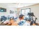 Spacious exercise room with hardwood floors, weight lifting equipment, and a TV at 3006 Gold Creek Dr, Villa Rica, GA 30180