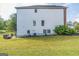 Side view of a well-maintained home featuring green lawn and tasteful landscaping at 3006 Gold Creek Dr, Villa Rica, GA 30180