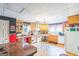 Kitchen with wood cabinets, updated appliances, an island, and casual dining space at 3006 Gold Creek Dr, Villa Rica, GA 30180