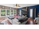 Inviting living room with hardwood floors, a fireplace, and large windows offering natural light at 3006 Gold Creek Dr, Villa Rica, GA 30180