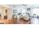 Bright primary bedroom boasting hardwood floors, a ceiling fan, a seating area, and natural light at 3006 Gold Creek Dr, Villa Rica, GA 30180