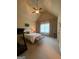 Bright bedroom features neutral walls and carpet, a ceiling fan and a large window at 1345 Cashiers Way, Roswell, GA 30075