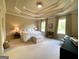 Spacious bedroom features trey ceilings, neutral paint and carpet at 1345 Cashiers Way, Roswell, GA 30075