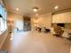 Large bonus room with built-in cabinetry, neutral carpet, and a view to the outside at 1345 Cashiers Way, Roswell, GA 30075