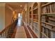 Upstairs hallway with wood flooring and large bookcases at 1345 Cashiers Way, Roswell, GA 30075