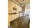 Bright laundry room with granite countertops, custom cabinets, and modern appliances at 1345 Cashiers Way, Roswell, GA 30075
